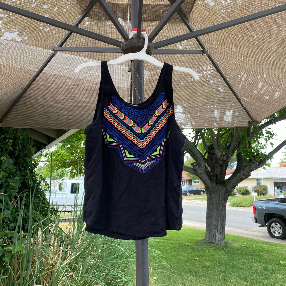 Black tank top with neon embroidered design